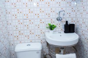 a bathroom with a toilet and a sink at Summer Residence Kos in Kos Town +35 photos
