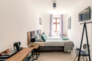 Posteľ alebo postele v izbe v ubytovaní Cooltour Hostel