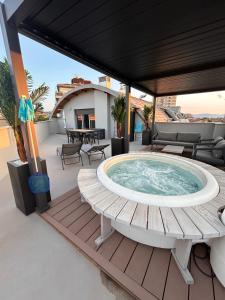 a hot tub on the deck of a house at Suite Panoramic Attico in Terni +47 photos