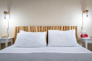 Кровать или кровати в номере Mareblù - Tuscany Green Aparthotel