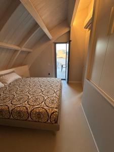 a bedroom with a bed in a room at Suite Panoramic Attico con Jacuzzi Privata in Terni