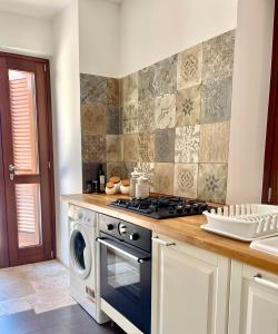 A kitchen or kitchenette at Masseria Lacatena