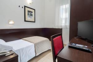 TV a/nebo společenská místnost v ubytování Union Park Hotel