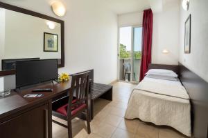 Postel nebo postele na pokoji v ubytování Union Park Hotel