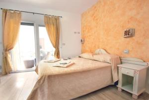 Postel nebo postele na pokoji v ubytování Domo La Vela - Affittacamere - Living Sant'Antioco