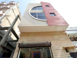 a building with a round window on top of it at Hotel O Mall Residency in Amritsar