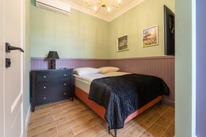 Postel nebo postele na pokoji v ubytování Apartamenty Galeria Trunków