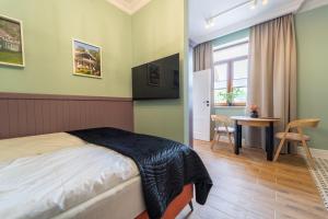 Postel nebo postele na pokoji v ubytování Apartamenty Galeria Trunków