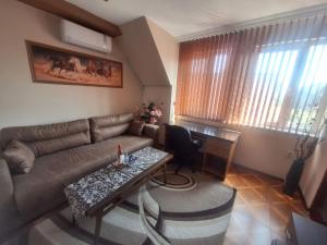 a living room with a couch and a table at Lily Aparts in Varna City