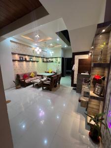 a living room with a couch and a table at The Roots of Jaipur Home stay in Jaipur