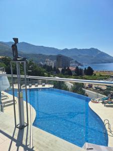 a view of a swimming pool on top of a building at Skyline sea view apartment in Becici