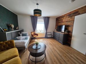 a living room with a couch and a table at Haus Kabelitz in Kabelitz