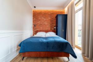 Postel nebo postele na pokoji v ubytování Apartamenty Galeria Trunków