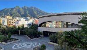 a building with a labyrinth in front of a city at C&C Suites in Los Llanos de Aridane