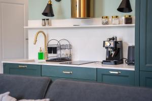 Kuchyň nebo kuchyňský kout v ubytování Apartamenty Galeria Trunków