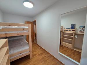 Ένα ή περισσότερα κρεβάτια σε δωμάτιο στο Apartamento Uxín +2 φωτογραφίες