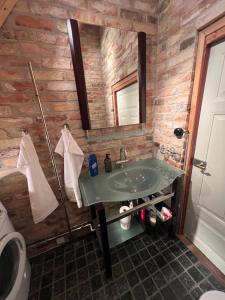 a bathroom with a sink and a mirror at Half-timbered house in Österlen in Sjöbo +48 photos