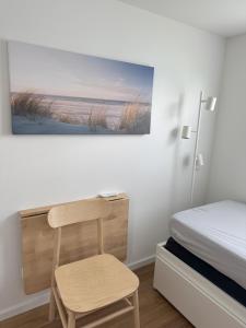 Postel nebo postele na pokoji v ubytování Prima Resort Boddenblick - Camping-Stellplätze - Tiny Houses & Ferienwohnungen in Ostsee Nähe