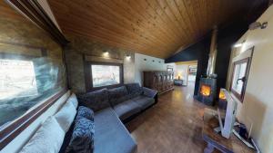 a living room with a couch and a fireplace at Senda de las Higueras in San Pedro de Latarce
