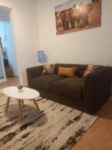 a living room with a couch and a table at SK Homes in Kilifi