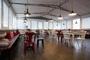 a dining room with tables and chairs and tablesktop at Campus Circuito 71 - Casa per Ferie in Pescara