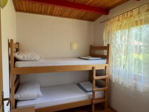 two bunk beds in a room with a window at Villa Giulia in Bihać