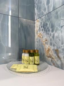 three jars of food on a plate with a napkin at Country Rooms Medicina B&B - Free Breakfast - Air Conditioning - WiFi in Medicina