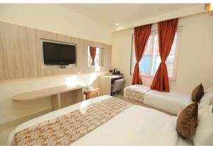 Postel nebo postele na pokoji v ubytování Hotel Zed -Near IGI-Airport-Terminal-3