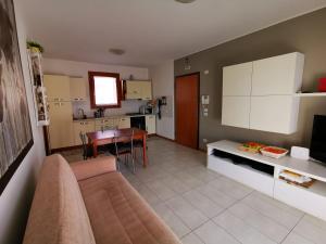 a living room with a couch and a table at Your retreat in Mestre - Venezia comoda a due passi in Venice