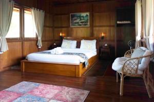 Uma cama ou camas num quarto em Manigelang Villa