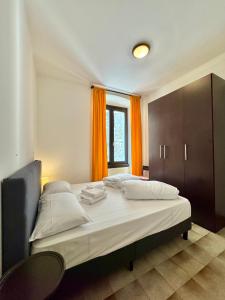 Кровать или кровати в номере 1Dest - Appartamento La Torre