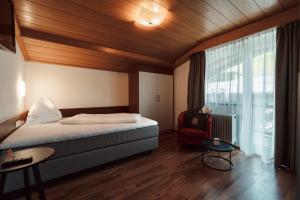 Llit o llits en una habitació de Hotel Tannenberg