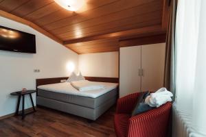 Llit o llits en una habitació de Hotel Tannenberg
