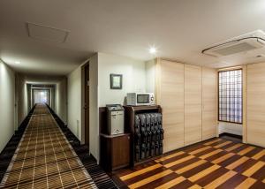 TV a/nebo společenská místnost v ubytování Fukui Manten Hotel Ekimae