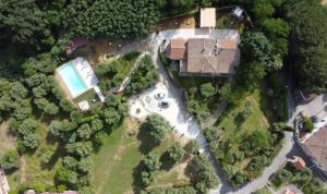 an aerial view of a house with a swimming pool at Casal di Peppe B&B in Lorenzana +90 photos