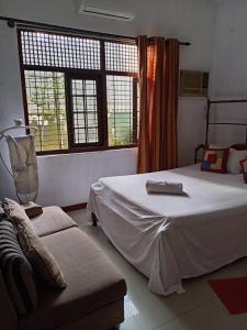 Postel nebo postele na pokoji v ubytování The Sanhida Guest House Colombo