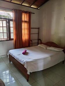 Postel nebo postele na pokoji v ubytování The Sanhida Guest House Colombo