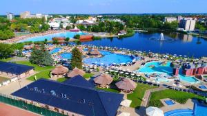 an aerial view of a resort with a large pool at Hotel Aurum Family "A" in Hajdúszoboszló