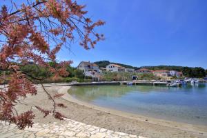 a view of a beach with boats in the water at Olea House in Lukoran