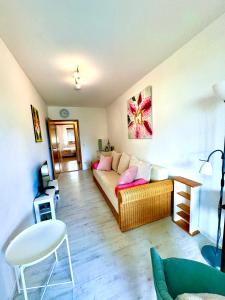 a living room with a couch and a table at Privatzimmer Hanna in Dießen am Ammersee +36 photos