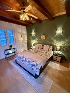 a bedroom with a large bed and two night stands at MY DALMATIA - Holiday home Casa K A in Kukljica