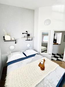 a bedroom with a large bed with a brown shoe on it at Modern Apartment in Primošten in Primošten