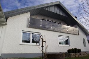 a house with a large window on the side of it at Ferienwohnung-Milena in Gundelfingen an der Donau