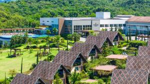 an aerial view of a resort with a row of roofs at Resort Ecoar in Gaspar