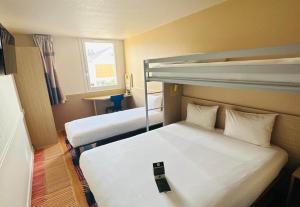 Postel nebo postele na pokoji v ubytování B&B HOTEL Saint-Witz Roissy + 35 fotografií