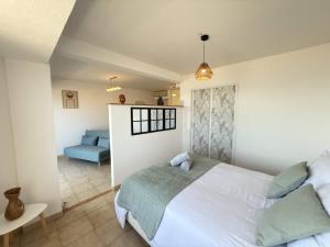 En eller flere senge i et værelse på Valras-Loc - Front de Mer avec Vue Superbe