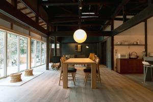 a kitchen and dining room with a table and chairs at 紡舎 - BO-SHA - - 古民家一棟貸しVilla in Akiruno