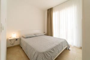 En eller flere senge i et værelse på GuestHost - Borgo 84 Marzamemi - Brezza Marina + 14 billeder