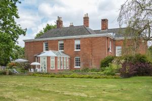 an old red brick house with a yard at Lingwood Hall in Lingwood +14 photos