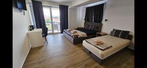a living room with a bed and a couch at Villa Natali in Ohrid